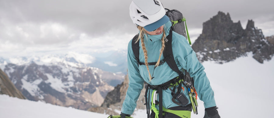 A mountaineer in a BD shell on a glacier.