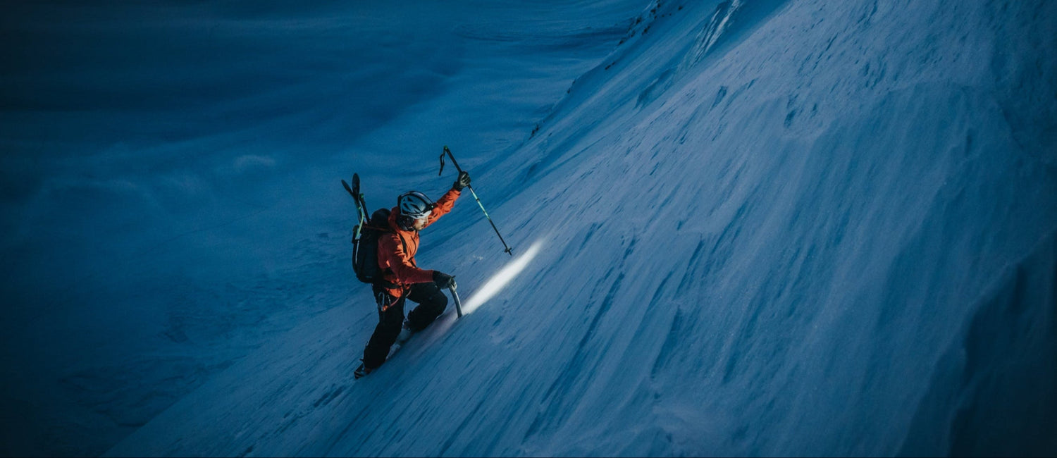 Two hikers light the up trail in the Dolomites, Italy.