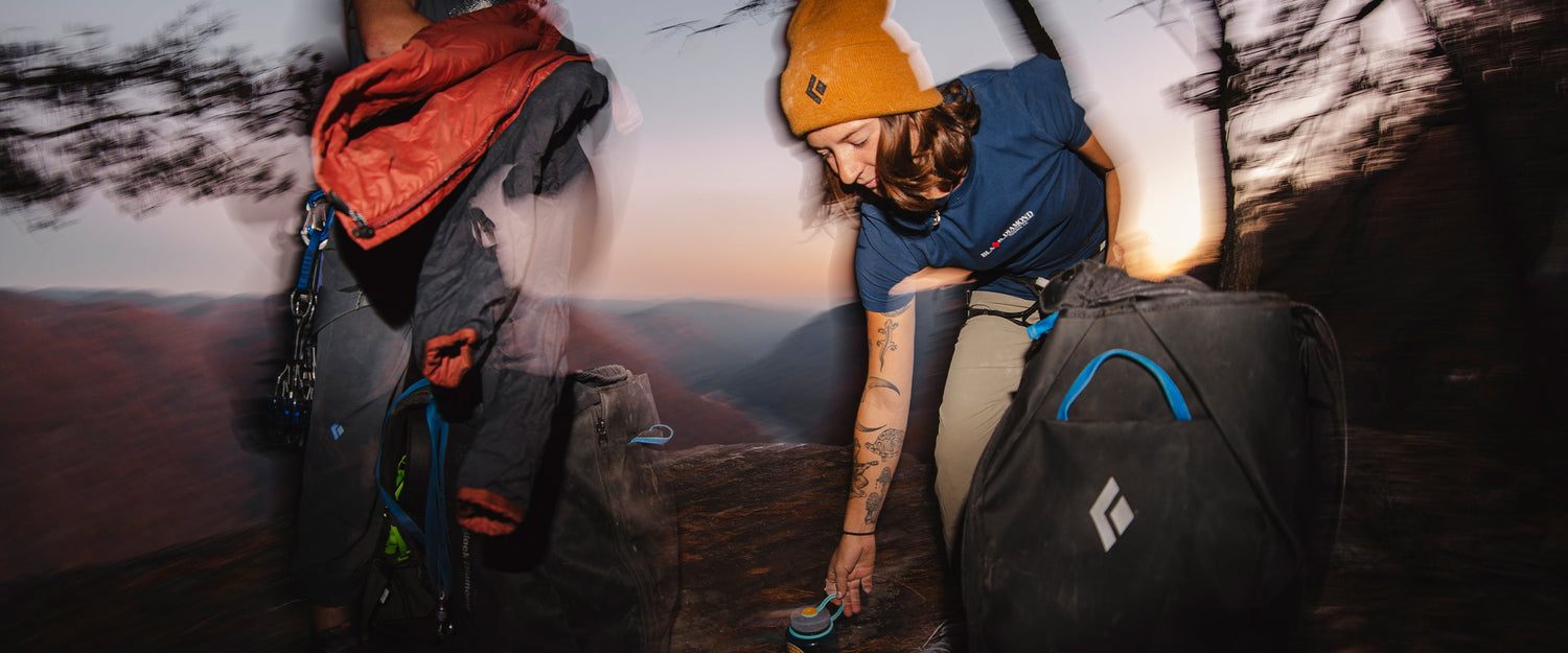 A climber in Chatanooga, TN picks up a water bottle