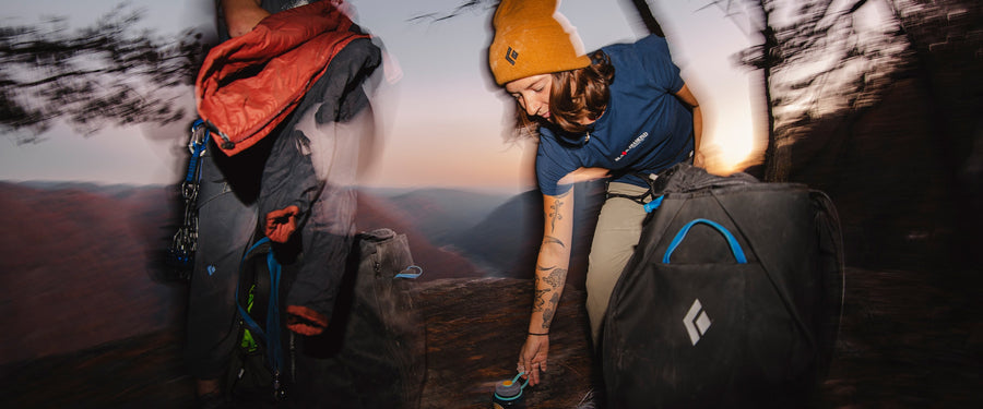 A climber in Chatanooga, TN picks up a water bottle