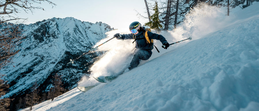 A skier skins up a hill in Washington