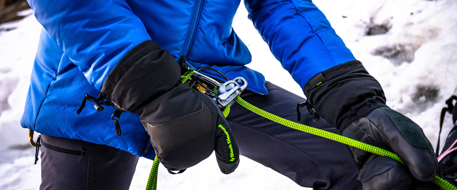 A person belaying in Black Diamond gloves