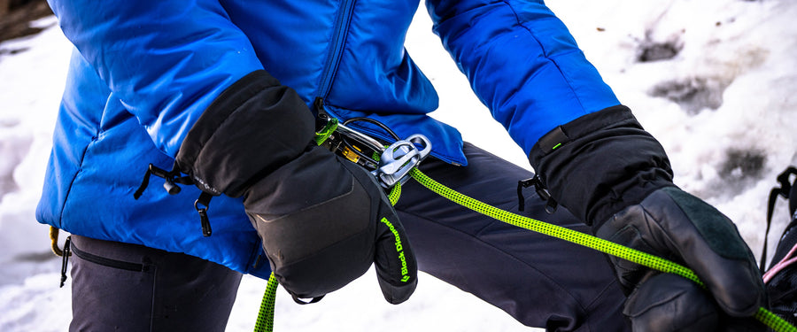 A person belaying in Black Diamond gloves