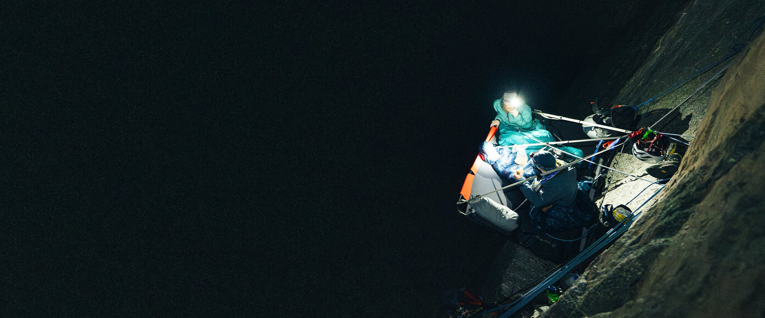BD athlete Hazel Findlay and her partner on a portaledge in the dark