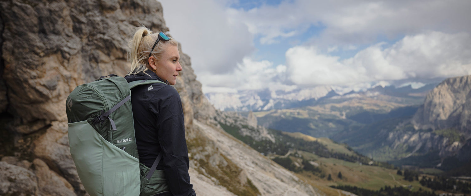 A hiker in the Dolomites wearing the trail vista 20 pack