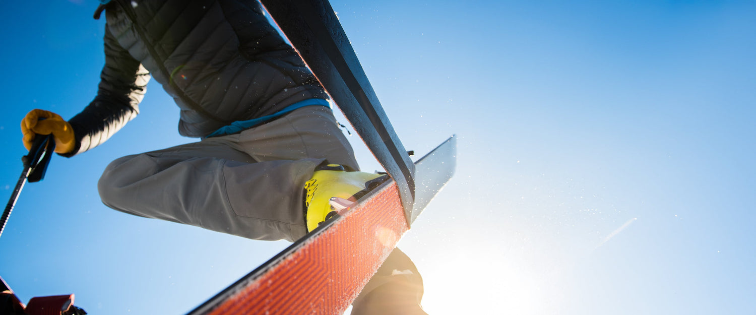 A skier removing their climbing skins
