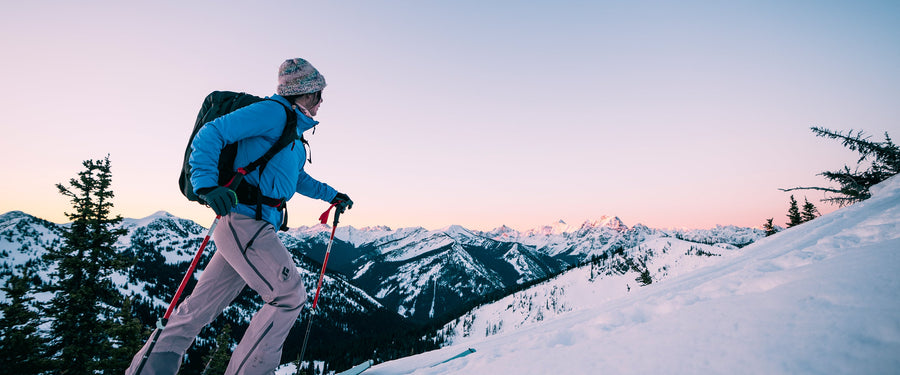 A skier skins up a hill in Washington