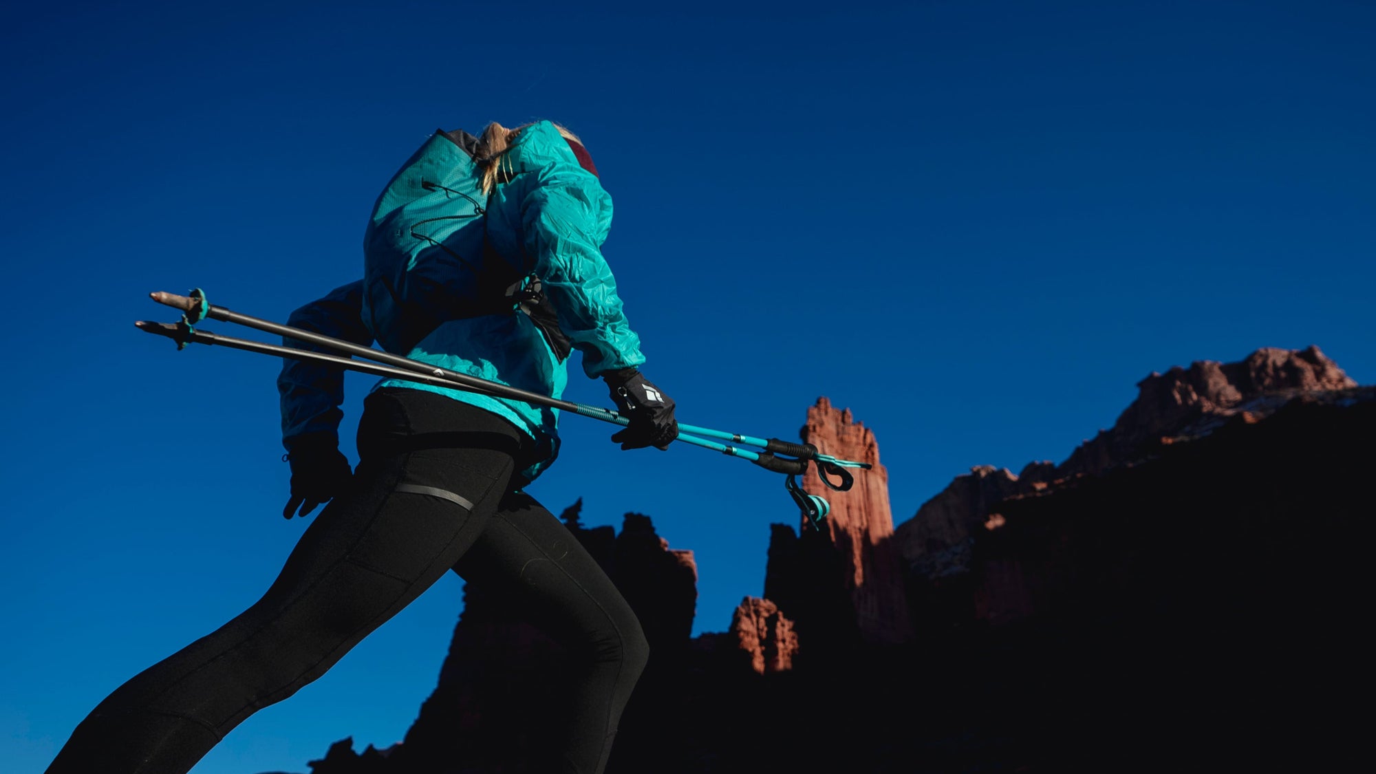 BD athlete Kelly Halpin carries Black Diamond Distance Poles. 