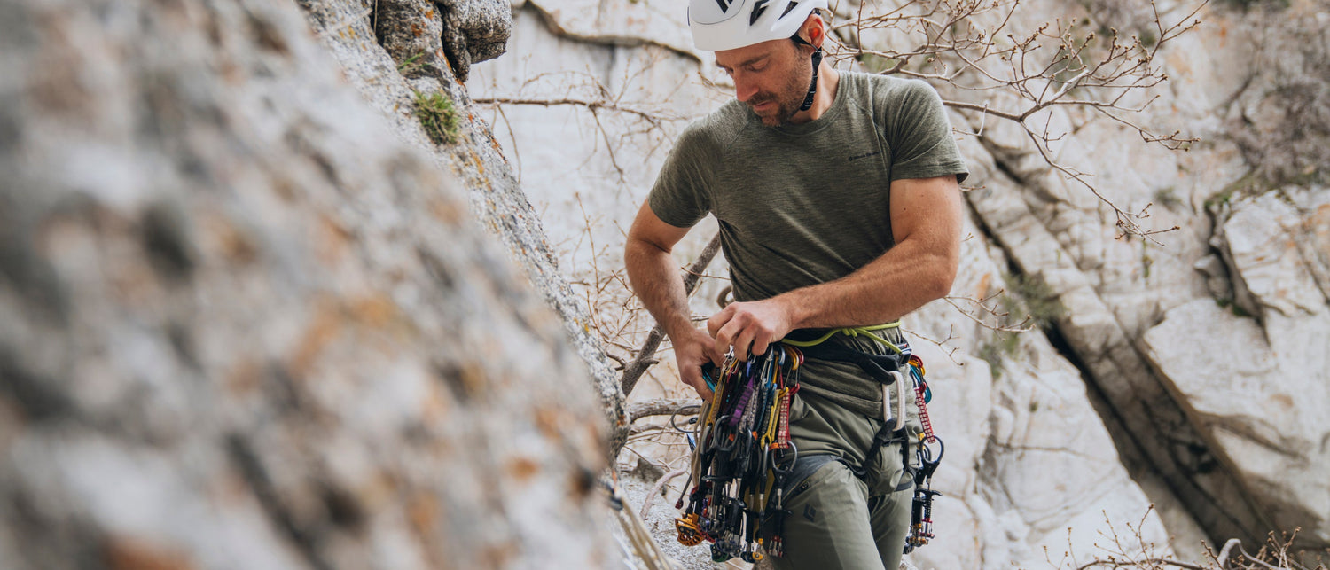 A climber racks up in Little Cottonwood. 