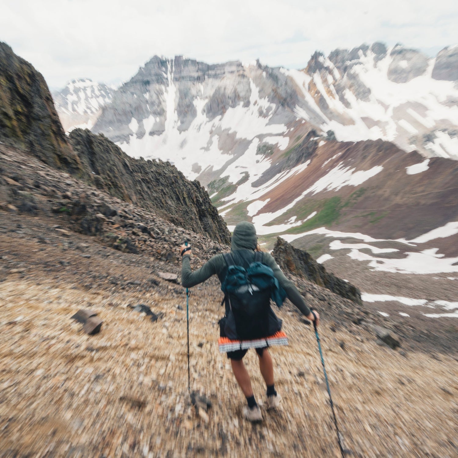 BD athlete Joe Grant runs down scree on a mountian. 
