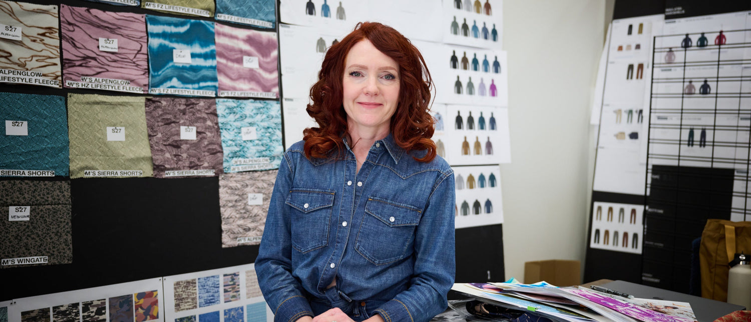 Heidi Lister Hevsy in front of fabric swatches.