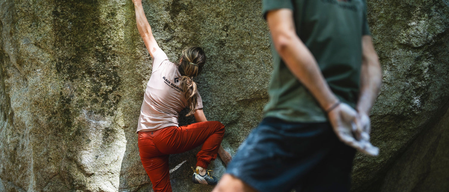 A boulderer reaches for a chalked hold in Squamish. 