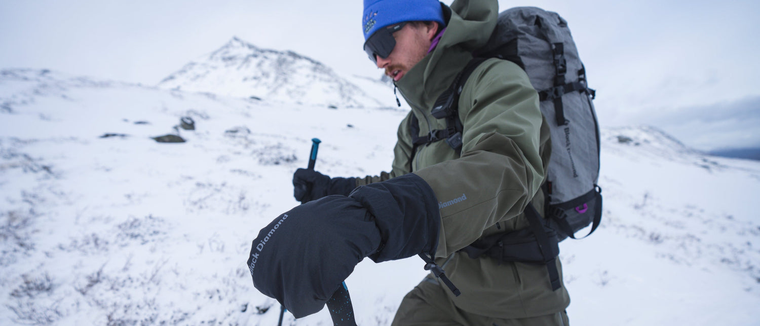 A ski tourer wears Black Diamond gloves. 