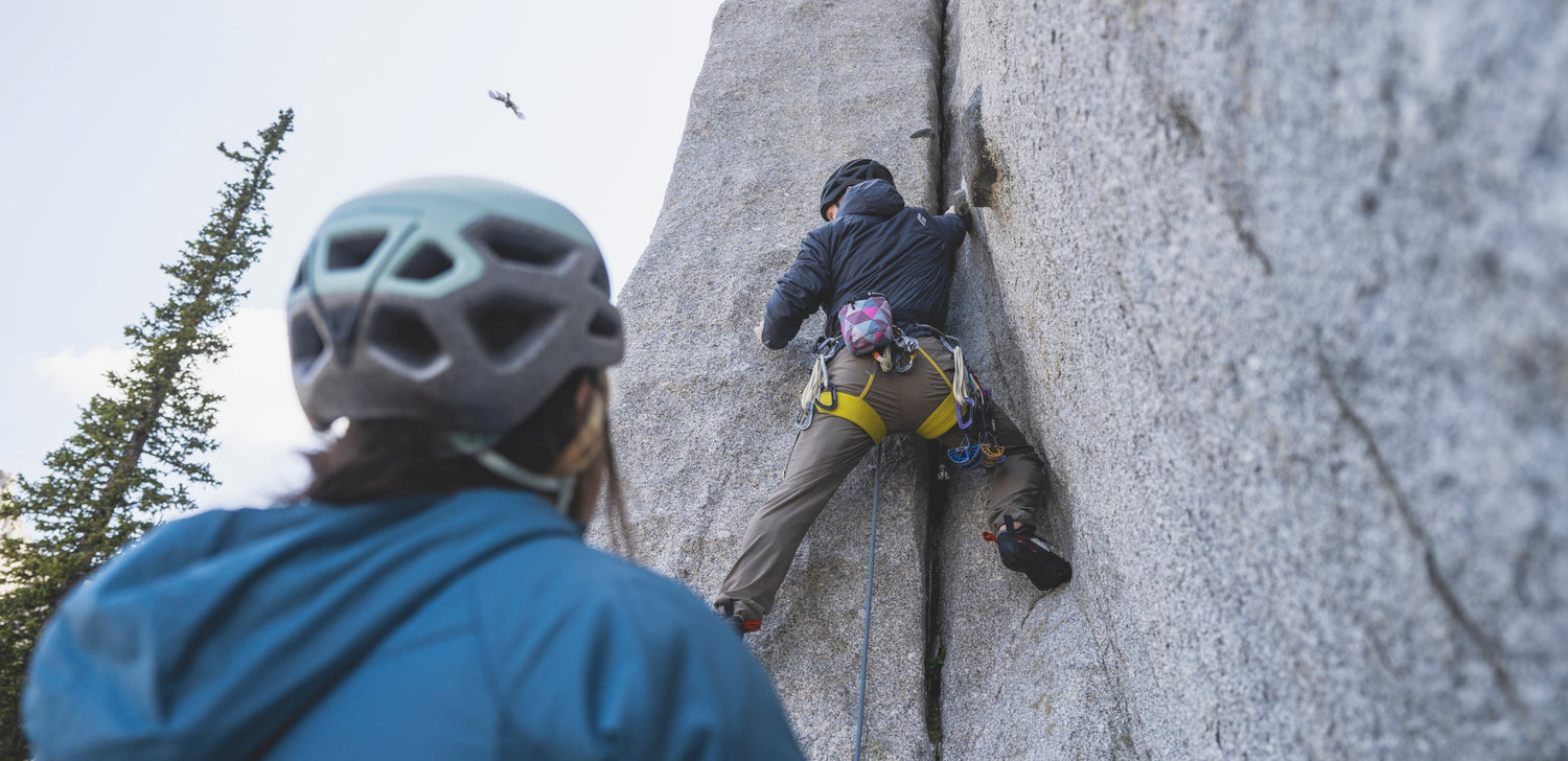 Two climbers in Solution 2.0 Hoodies. 